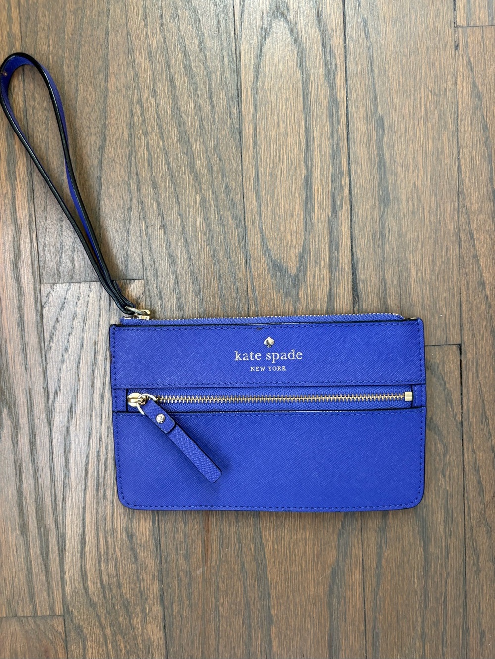 kate spade cobalt blue wristlet clutch with gold hardware